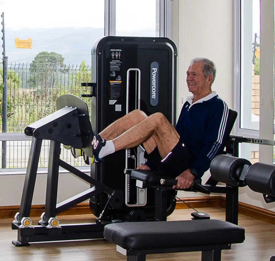 An older member on the leg press